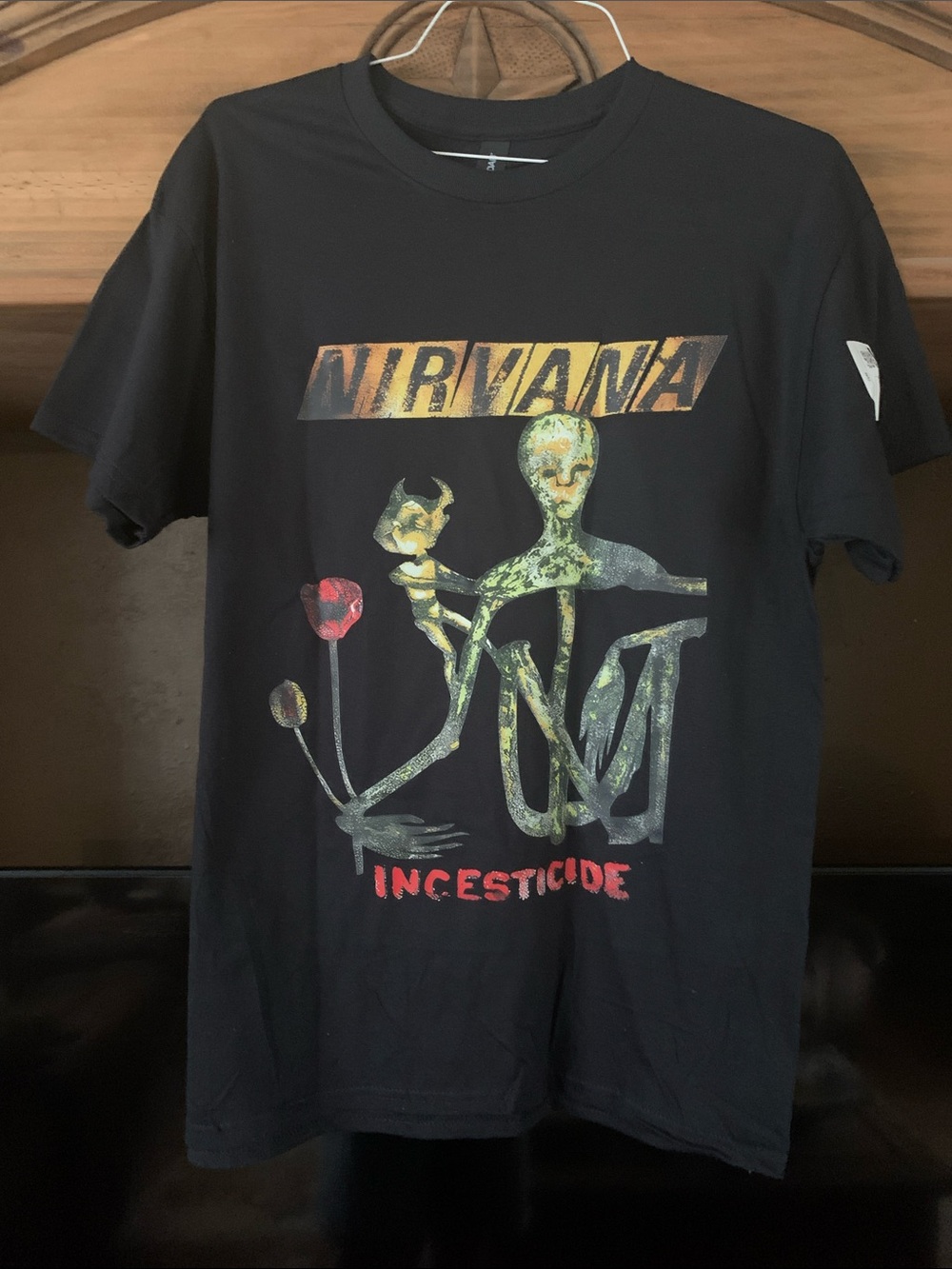 NIRVANA Black Short-Sleeve Tee with Multicolor Incesticide Graphic